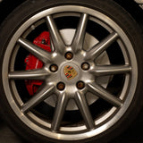 Rennline OE+ Rear Brake Rotor Pair: Vented, slotted, and GEOMET-coated for improved braking, heat dissipation, and rust protection. Shop now at PMB Performance.