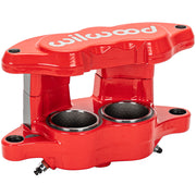Wilwood red brake caliper, angled open-side view with two circular recesses, mounting holes and white Wilwood lettering across the bridge