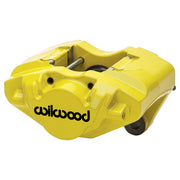 Wilwood yellow rear D31 caliper for Porsche 911 1984–1989, 0.94-inch rotor-width configuration, angled view showing the logo face, bridge and mounting features