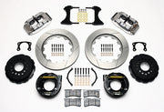 Wilwood rear Superlite 4R kit for new-style Big Ford 2.50-inch offset: shiny silver calipers and 14.00-inch slotted rotor pieces laid out