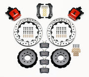 Wilwood rear CPB kit for Mustang solid axle, 3.25-inch offset: red calipers and 12.88-inch drilled/slotted rotor pieces laid out