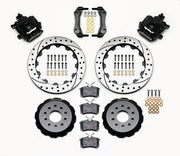 Wilwood rear CPB kit for Mustang solid axle, 3.25-inch offset: black calipers and 12.88-inch drilled/slotted rotor pieces laid out