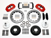 Wilwood front Superlite 6R kit for later Ford/Mercury disc spindles: red calipers and 12.88-inch drilled/slotted rotor pieces laid out