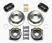 Wilwood rear Forged Dynapro Low Profile kit for 7.25 Mustang 2.80-inch offset: paired black calipers, 11.00-inch plain-face rotors and hardware laid out