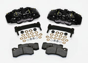 Wilwood black AERO6 front caliper and bracket kit, pads and mounting spacers laid out