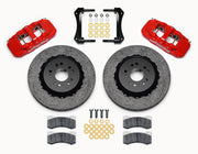 Wilwood Ford Mustang front carbon-ceramic brake kit, red AERO6 calipers and dark rotors laid out with pads and brackets