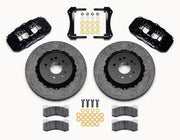 Wilwood Ford Mustang front carbon-ceramic brake kit, black AERO6 calipers and dark rotors laid out with pads and brackets