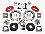 Wilwood TCI IFS front parts layout with red Superlite 6R calipers, 12.88-inch drilled-and-slotted rotors, separate hubs, bearings, pads and mounting brackets