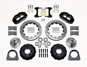 Wilwood TCI IFS front parts layout with black Superlite 6R calipers, 12.88-inch drilled-and-slotted rotors, separate hubs, bearings, pads and mounting brackets
