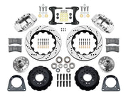 Wilwood TCI IFS front parts layout with polished Superlite 6R calipers, 14-inch drilled-and-slotted rotors, separate hubs, bearings, pads and mounting brackets