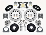 Wilwood TCI IFS front parts layout with black Superlite 6R calipers, 14-inch drilled-and-slotted rotors, separate hubs, bearings, pads and mounting brackets