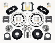 Wilwood TCI IFS front parts layout with black AERO6 calipers, 14-inch drilled-and-slotted rotors, separate hubs, bearings, pads and mounting brackets