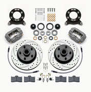 Wilwood Ford/Mercury front Dynalite-M brake kit laid out with anodized calipers, drilled and slotted rotor/hubs, bearings, pads and mounting hardware, with hoses