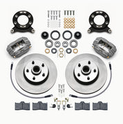 Wilwood Ford/Mercury front Dynalite-M brake kit laid out with anodized calipers, plain-face rotor/hubs, bearings, pads and mounting hardware, with hoses