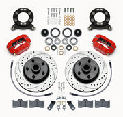 Wilwood later Ford/Mercury front Dynalite-M brake kit laid out with red calipers, drilled and slotted rotor/hubs, bearings, pads and mounting hardware, with hoses