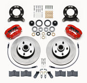 Wilwood later Ford/Mercury front Dynalite-M brake kit laid out with red calipers, plain-face rotor/hubs, bearings, pads and mounting hardware, with hoses