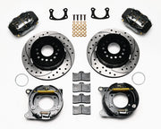 Wilwood BOP rear Dynalite parking-brake kit laid out with black calipers, drilled and slotted rotors, internal parking-shoe assemblies and mounting parts