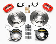 Wilwood BOP rear Dynalite parking-brake kit laid out with red calipers, plain-face rotors, internal parking-shoe assemblies and mounting parts