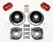 Wilwood BOP rear Dynapro Low-Profile parking-brake kit laid out with red calipers, drilled and slotted rotors, internal parking-shoe assemblies and mounting parts
