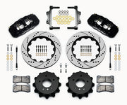 Wilwood BMW rear AERO4 brake kit laid out with black calipers, drilled and slotted rotors and hats, pads and mounting brackets, with hoses