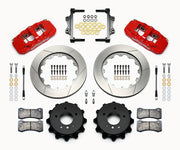 Wilwood BMW rear AERO4 brake kit laid out with red calipers, slotted rotors and hats, pads and mounting brackets, with hoses