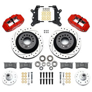Wilwood full-size front Superlite rotor-hat brake kit laid out with red calipers, drilled and slotted one-piece rotor/hats, separate hubs, pads and brackets