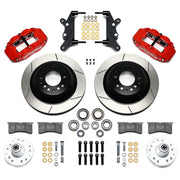 Wilwood full-size front Superlite rotor-hat brake kit laid out with red calipers, slotted one-piece rotor/hats, separate hubs, pads and brackets