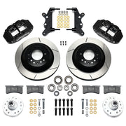 Wilwood full-size front Superlite rotor-hat brake kit laid out with black calipers, slotted one-piece rotor/hats, separate hubs, pads and brackets