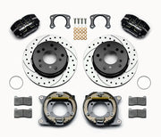 Wilwood Bronco New Style rear Dynapro parking-brake kit laid out with black calipers, drilled and slotted rotors, internal parking-shoe assemblies and mounting parts