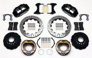 Wilwood staggered Big Ford New Style rear brake kit laid out with black calipers, drilled and slotted rotors, internal parking-shoe assemblies and mounting parts
