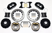 Wilwood staggered GM 12-bolt rear brake kit laid out with black calipers, drilled and slotted rotors, internal parking-shoe assemblies and mounting parts