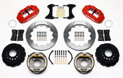 Wilwood staggered GM 12-bolt rear brake kit laid out with red calipers, slotted rotors, internal parking-shoe assemblies and mounting parts