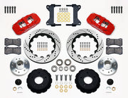 Wilwood Chevy/GMC drop-spindle front AERO6 brake kit laid out with red calipers, drilled and slotted rotor rings, hats, wheel hubs, pads and brackets