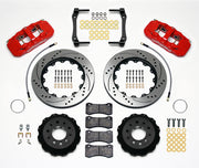 Wilwood Corvette C7 rear AERO4 brake kit laid out with red calipers, drilled and slotted rotors and hats, pads and mounting brackets, with hoses