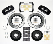 Wilwood Corvette C7 rear AERO4 brake kit laid out with black calipers, drilled and slotted rotors and hats, pads and mounting brackets, with hoses