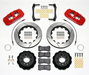 Wilwood Corvette C7 rear AERO4 brake kit laid out with red calipers, slotted rotors and hats, pads and mounting brackets, with hoses