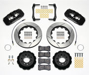 Wilwood Corvette C7 rear AERO4 brake kit laid out with black calipers, slotted rotors and hats, pads and mounting brackets, with hoses