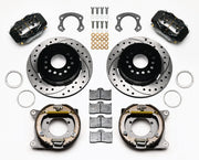 Wilwood Ford 8.8 Special rear Dynalite brake kit laid out with black calipers, drilled and slotted rotors, internal parking-shoe assemblies and mounting parts