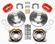 Wilwood Ford 8.8 Special rear Dynalite brake kit laid out with red calipers, plain-face rotors, internal parking-shoe assemblies and mounting parts