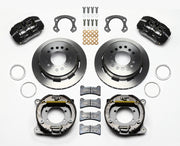 Wilwood Ford 8.8 Special rear Dynapro brake kit laid out with black calipers, plain-face rotors, internal parking-shoe assemblies and mounting parts