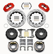 Wilwood Bronco 2.00-inch-offset rear 14-inch brake kit laid out with red calipers, drilled and slotted rotors, internal parking-shoe assemblies and mounting parts