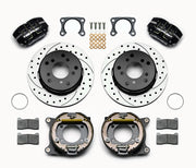 Wilwood Bronco 2.00-inch-offset rear Dynapro brake kit laid out with black calipers, drilled and slotted rotors, internal parking-shoe assemblies and mounting parts
