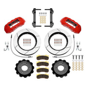 Wilwood six-lug Ford/Lincoln front TX6R brake kit laid out with red calipers, slotted rotors and hats, pads and mounting brackets, with hoses