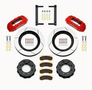 Wilwood Super Duty 4WD front TX6R brake kit laid out with red calipers, slotted rotors and hats, pads and mounting brackets