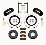 Wilwood Super Duty 4WD front TX6R brake kit laid out with black calipers, slotted rotors and hats, pads and mounting brackets