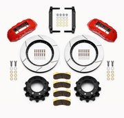 Wilwood Super Duty 4WD rear TX6R brake kit laid out with red calipers, slotted rotors and hats, pads and mounting brackets