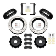 Wilwood black TX6R kit laid out with drilled-and-slotted rotor rings, separate hats, brake pads, brackets and hardware