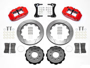 Wilwood red Superlite 6R kit laid out with slotted rotor rings, separate hats, brake pads, brackets and hardware