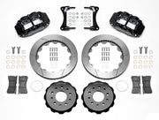 Wilwood black Superlite 6R kit laid out with slotted rotor rings, separate hats, brake pads, brackets and hardware
