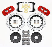 Wilwood red AERO6 kit laid out with drilled-and-slotted rotor rings, separate hats, brake pads, brackets and hardware